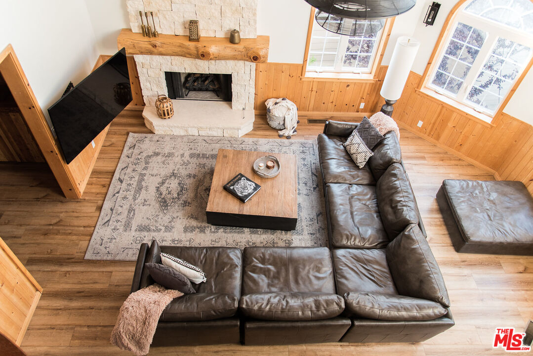 668 Cove Drive Big Bear Lake, CA 92315 - Photo 3 of 31 a living room with furniture and a fireplace