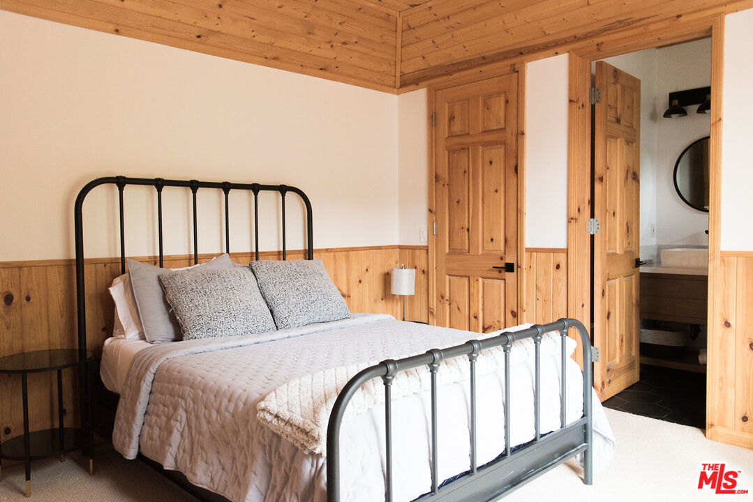 668 Cove Drive Big Bear Lake, CA 92315 - Photo 23 of 31 a bed room with a bed and a window