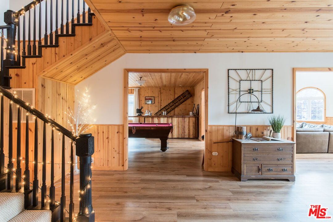 668 Cove Drive Big Bear Lake, CA 92315 - Photo 10 of 31 a view of entryway livingroom and hall with wooden floor