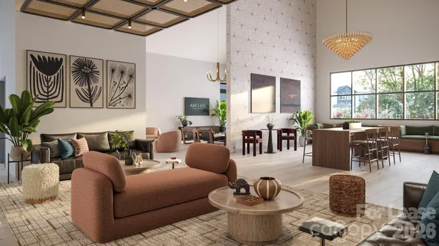 a living room with furniture large window and wooden floor