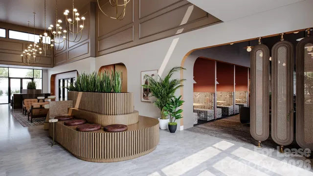 a living room with furniture and a potted plant