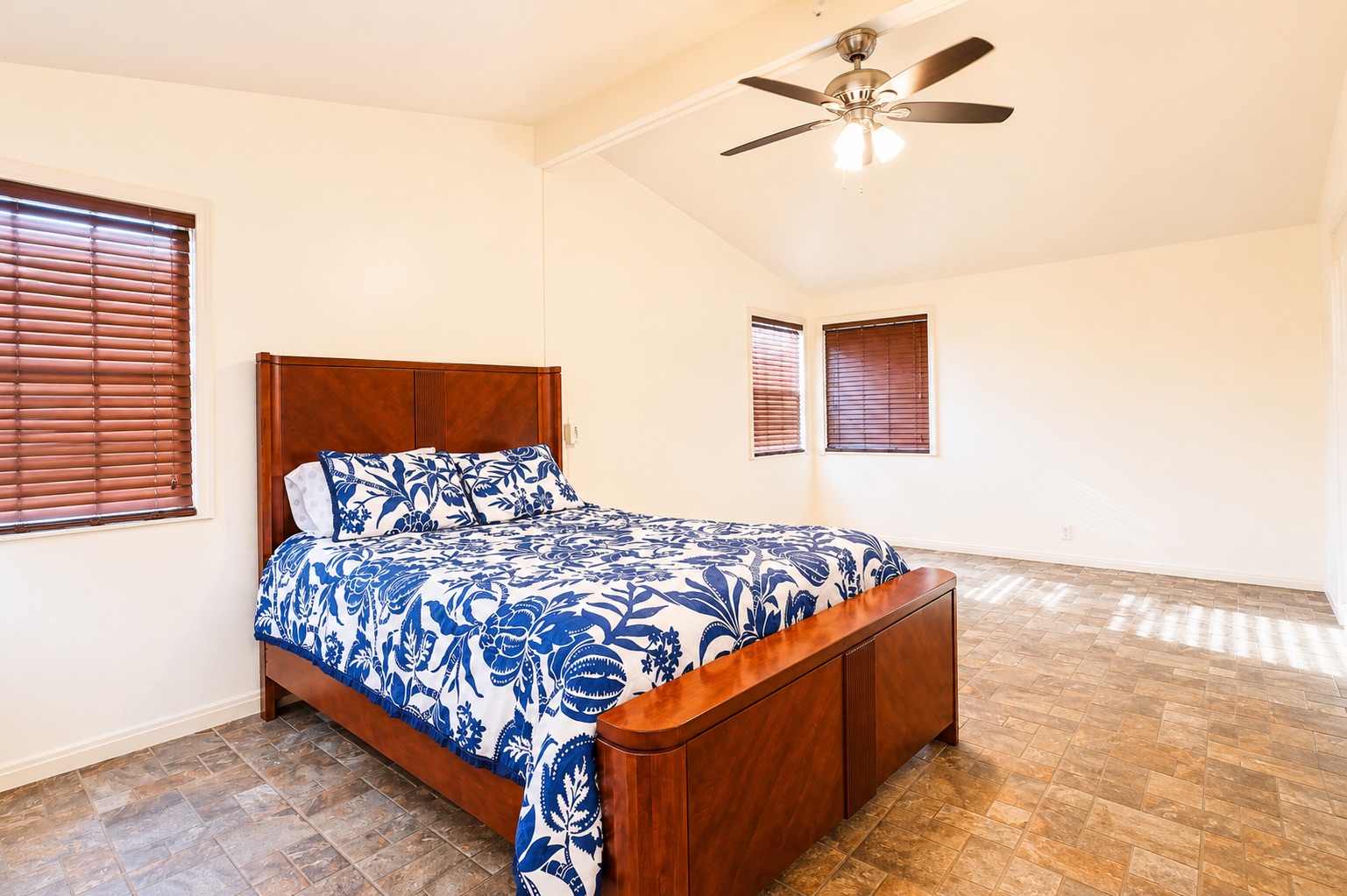 1508 Walnut Street Georgetown, TX 78626 - Photo 23 of 37 Natural light filters through the blinds into this spacious sleeping area with vaulted ceilings.