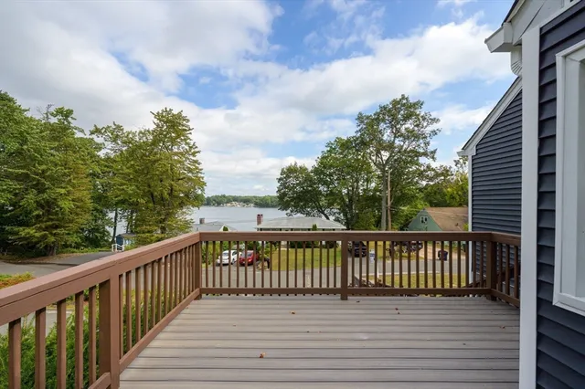 an aerial view of a residential houses with outdoor space and street view