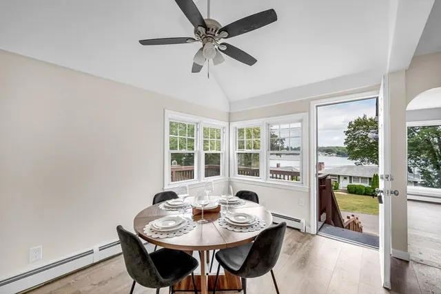 a view of a dining room with furniture window and outside view