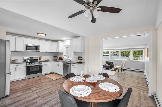 a kitchen with a table and chairs in it