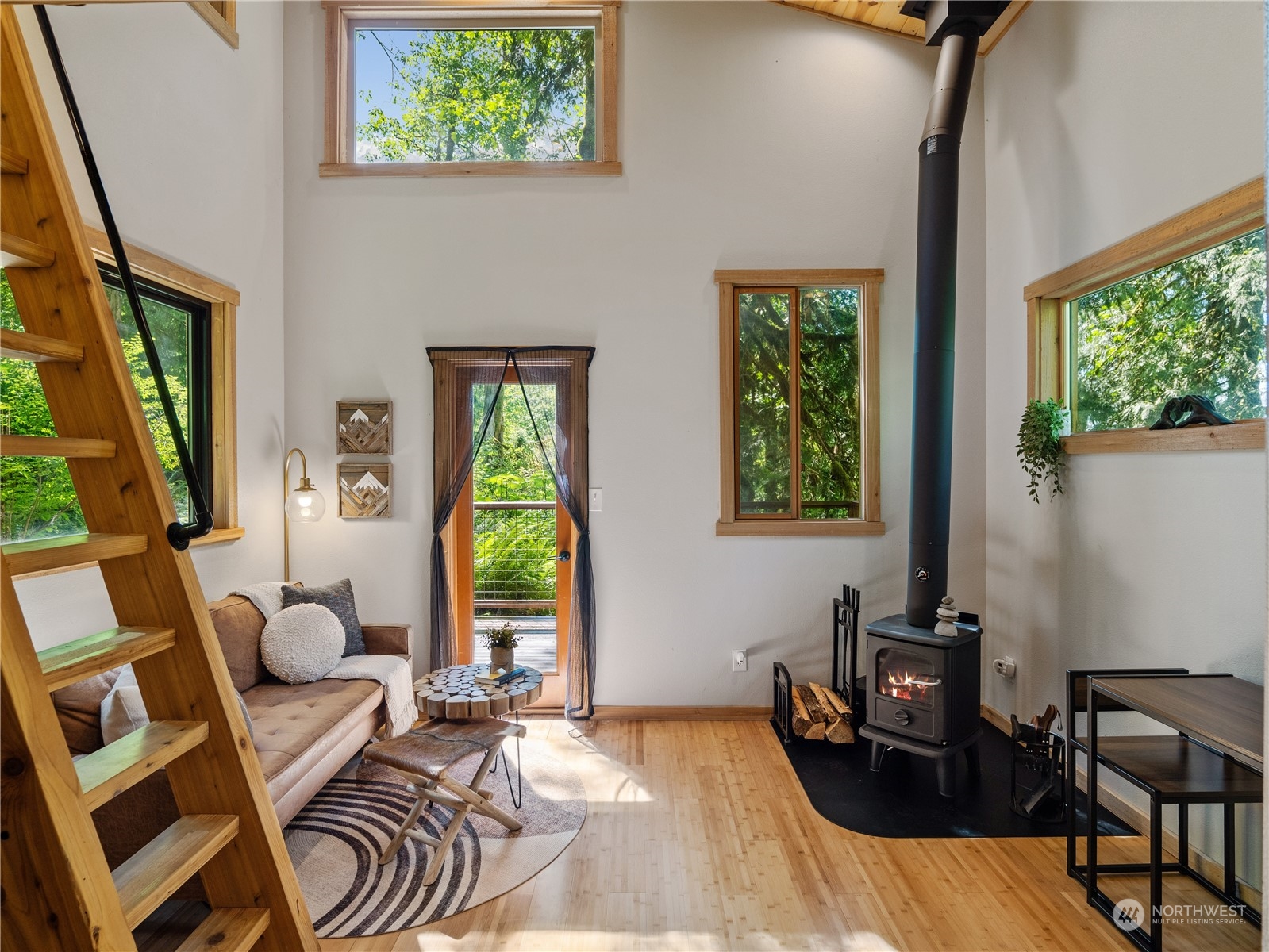 51818 South Riverside Road Gold Bar, WA 98251 - Photo 22 of 35 a bedroom with a bed and wooden floor