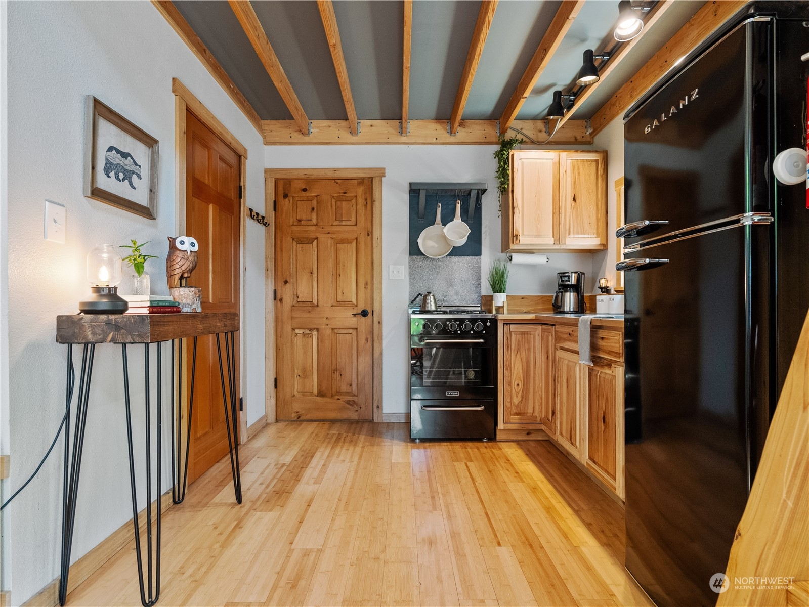 51818 South Riverside Road Gold Bar, WA 98251 - Photo 23 of 35 a view of a kitchen with furniture and wooden floor
