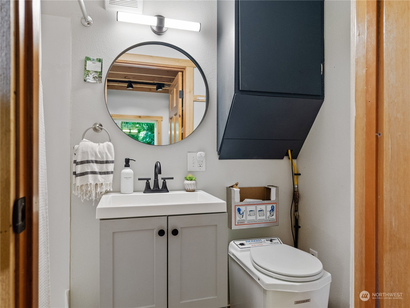 51818 South Riverside Road Gold Bar, WA 98251 - Photo 24 of 35 a bathroom with a toilet sink and mirror