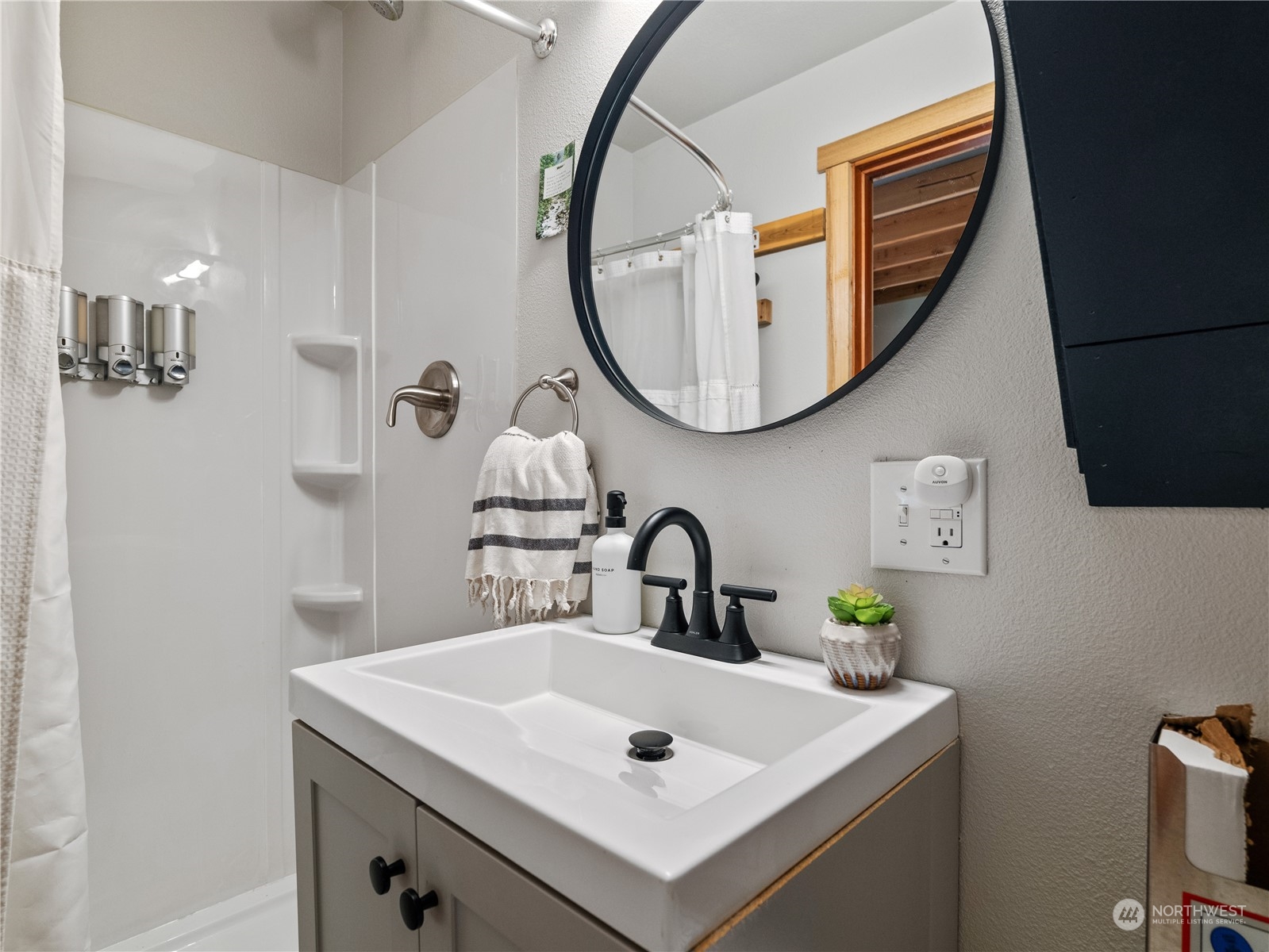 51818 South Riverside Road Gold Bar, WA 98251 - Photo 25 of 35 a bathroom with a sink a mirror and a toilet