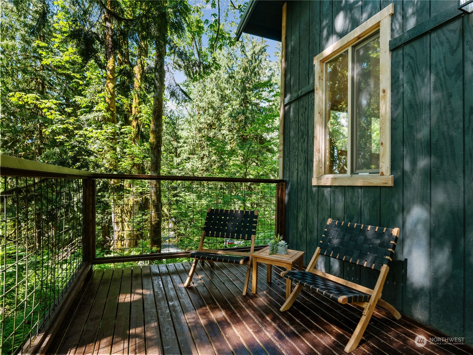51818 South Riverside Road Gold Bar, WA 98251 - Photo 27 of 35 a view of balcony with furniture and wooden floor