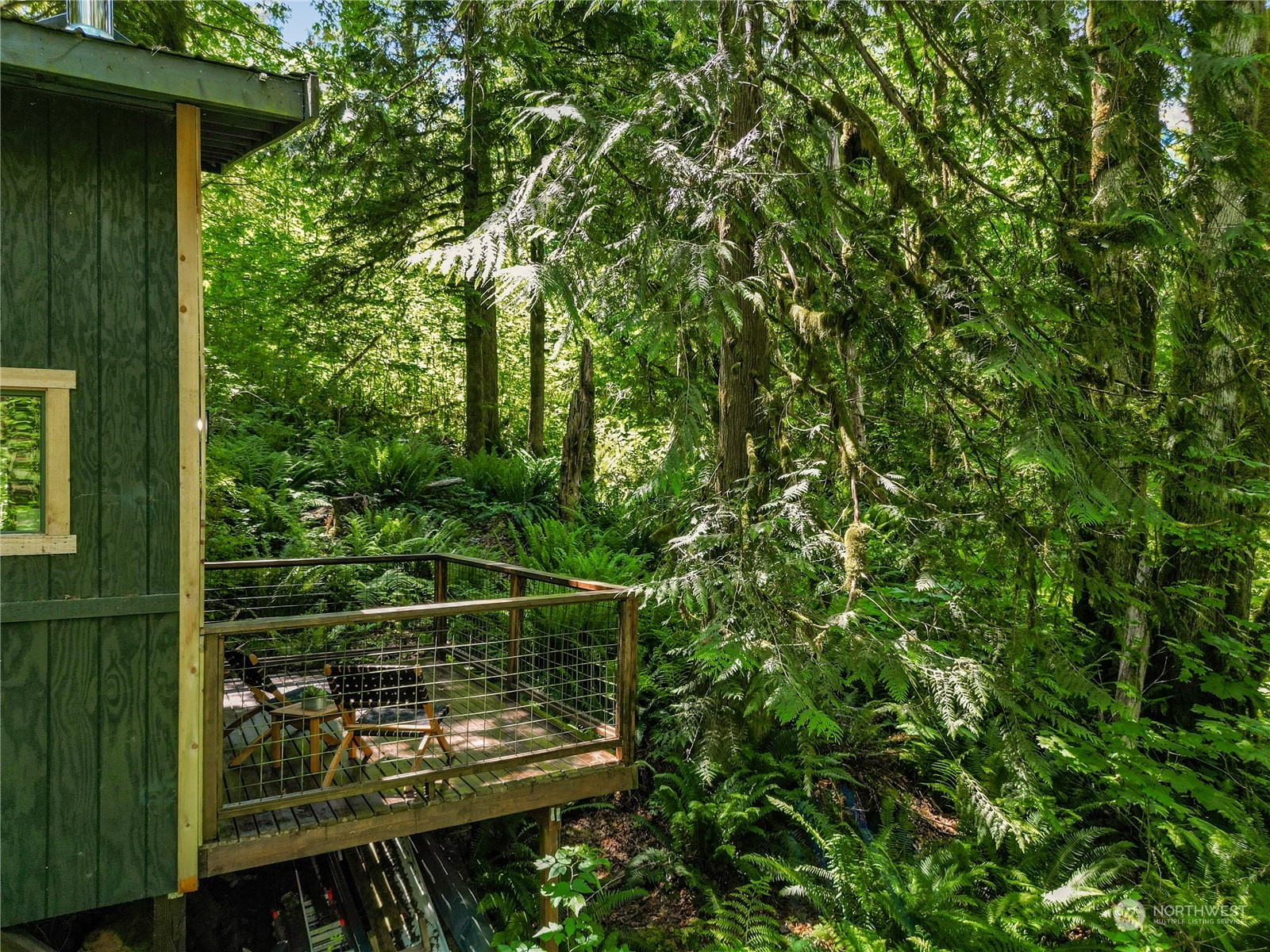 51818 South Riverside Road Gold Bar, WA 98251 - Photo 29 of 35 a view of a chair and table in the balcony