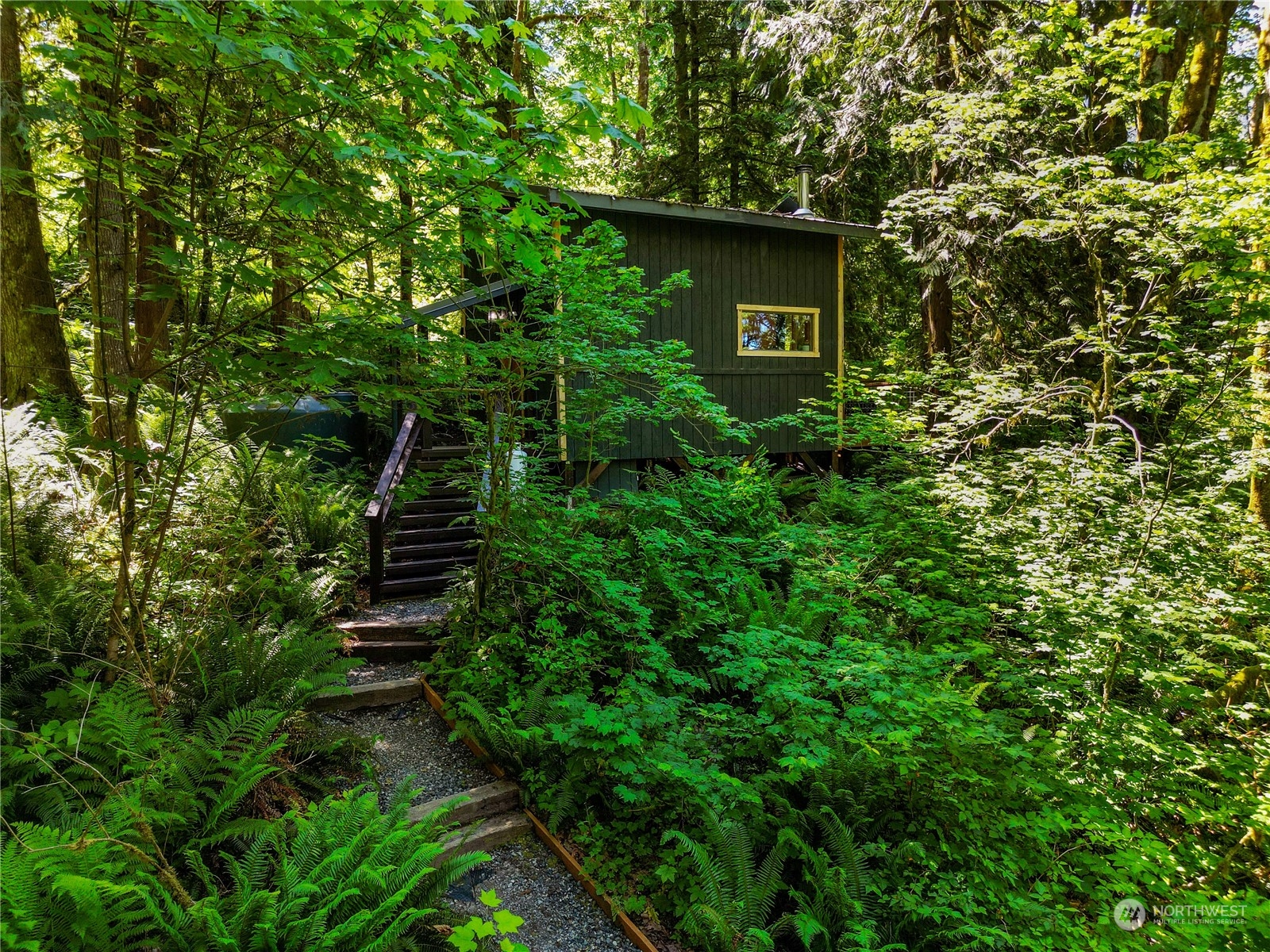 51818 South Riverside Road Gold Bar, WA 98251 - Photo 30 of 35 a view of a house with a tree