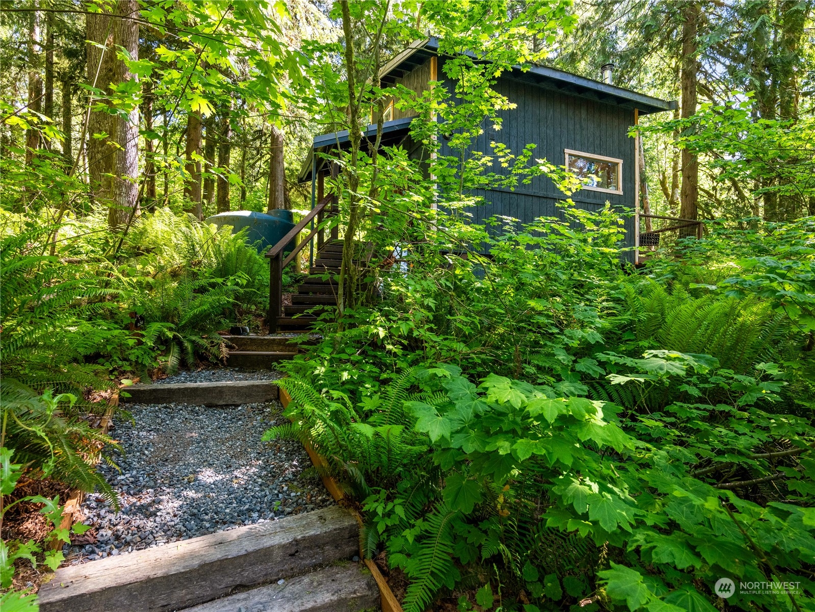 51818 South Riverside Road Gold Bar, WA 98251 - Photo 3 of 35 a view of a garden with plants