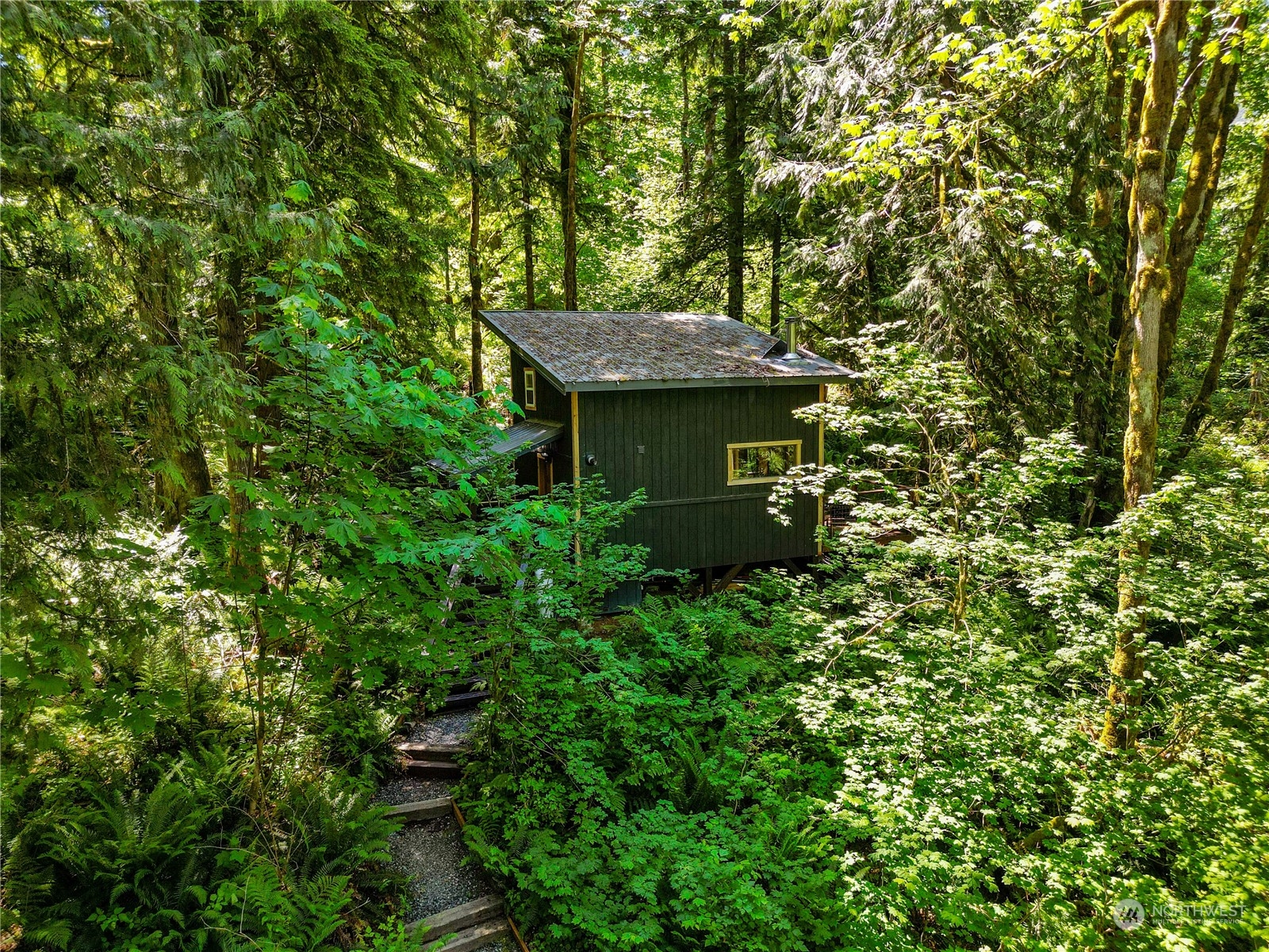 51818 South Riverside Road Gold Bar, WA 98251 - Photo 31 of 35 a view of a house with a tree