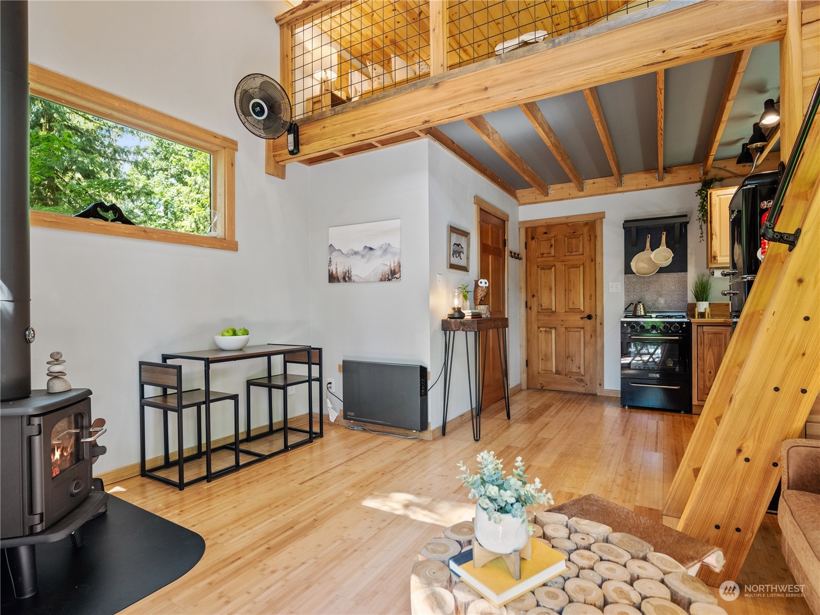 51818 South Riverside Road Gold Bar, WA 98251 - Photo 6 of 35 a view of a hallway with furniture and a kitchen view