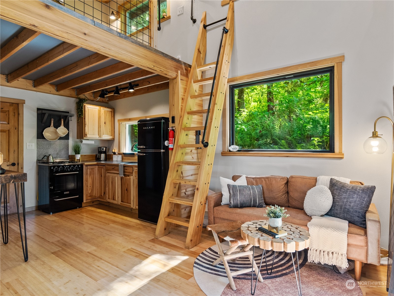 51818 South Riverside Road Gold Bar, WA 98251 - Photo 8 of 35 a living room with furniture and a flat screen tv