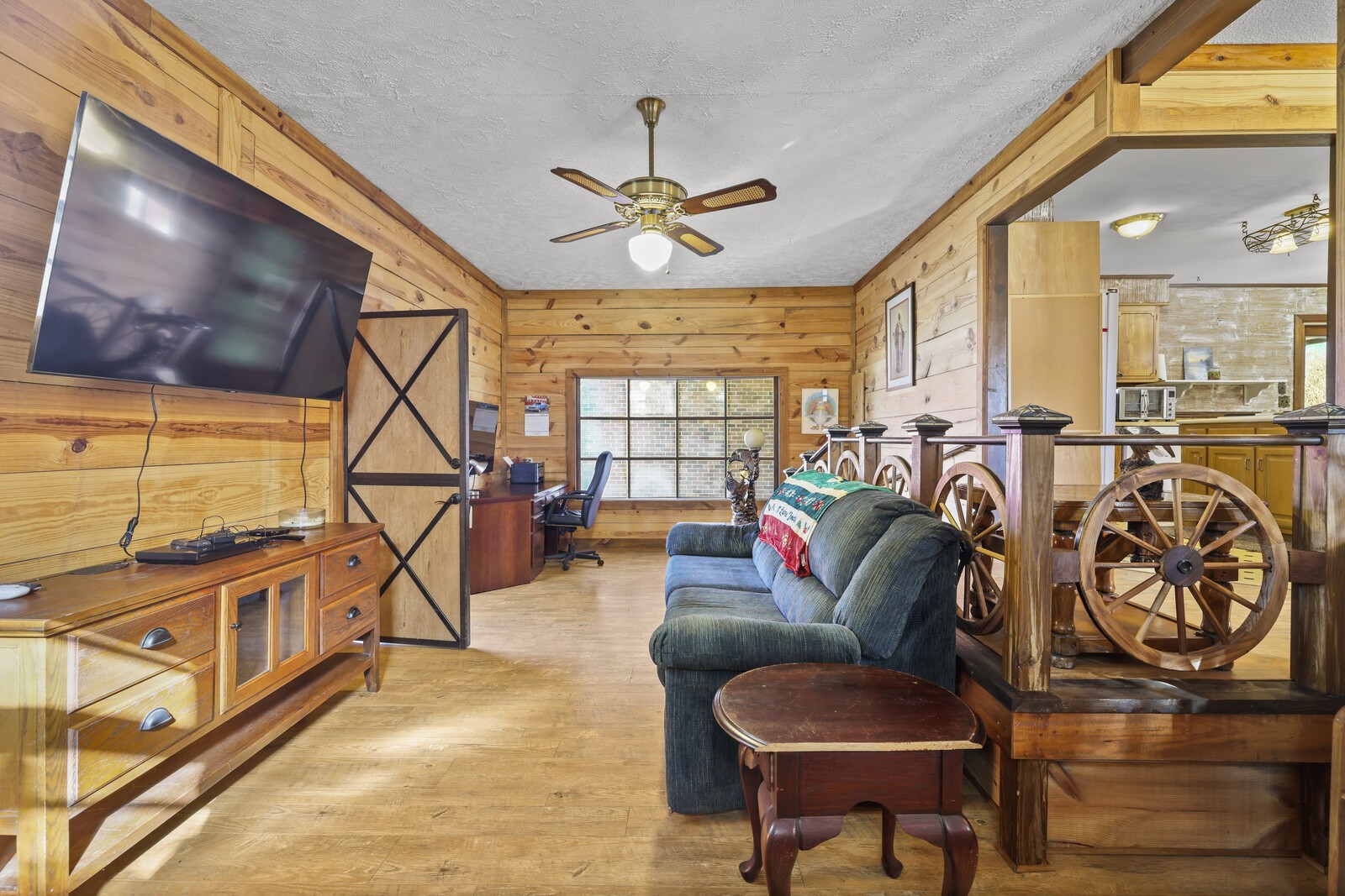 2521 Old Airport Road Hillsboro, TN 37342 - Photo 11 of 87 a living room with furniture a flat screen tv and a floor to ceiling window