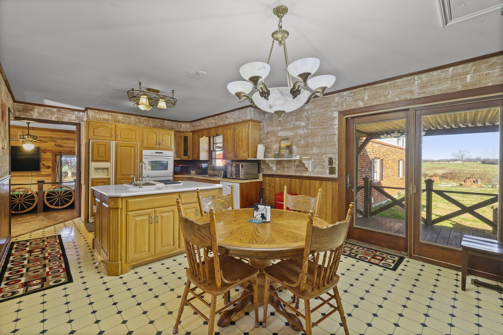 2521 Old Airport Road Hillsboro, TN 37342 - Photo 18 of 87 a view of a dining room with furniture a chandelier and wooden floor