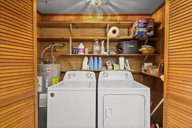 a bedroom with a bed and bathroom