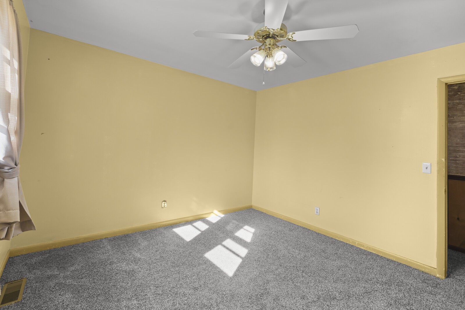 2521 Old Airport Road Hillsboro, TN 37342 - Photo 22 of 87 an empty room with a chandelier fan and a window