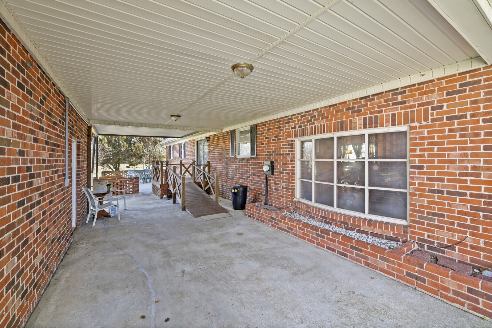 2521 Old Airport Road Hillsboro, TN 37342 - Photo 33 of 87 a view of a porch with furniture and floor to ceiling window