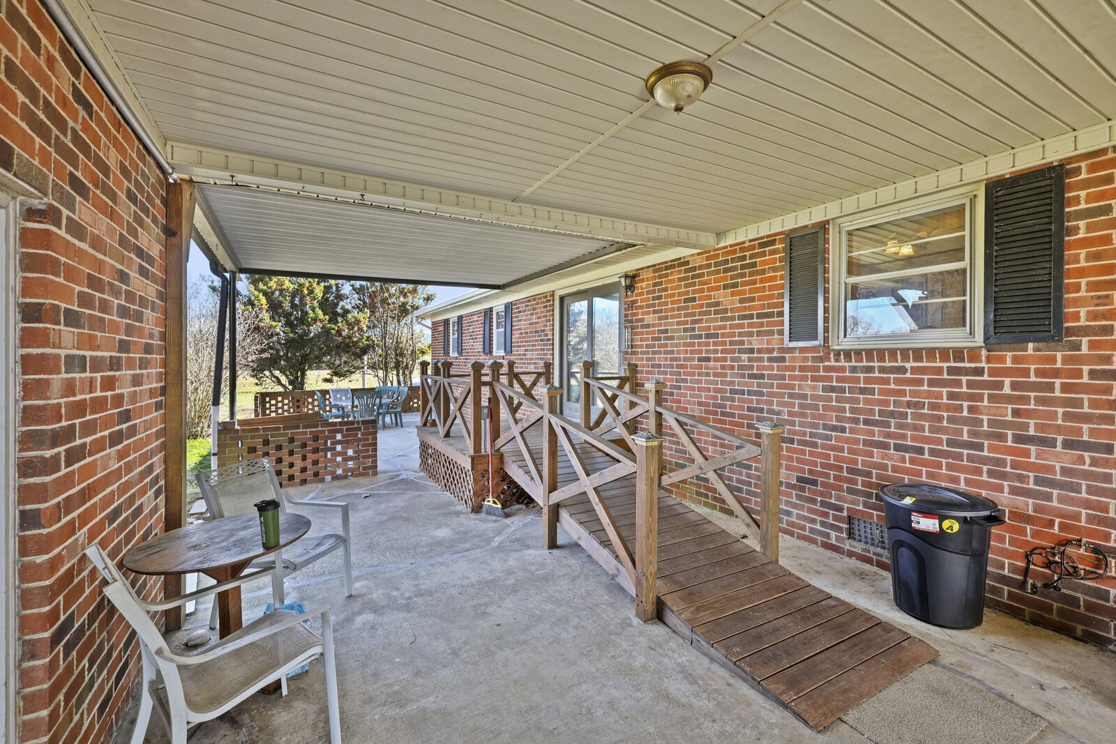 2521 Old Airport Road Hillsboro, TN 37342 - Photo 35 of 87 a view of a patio with table and chairs and potted plants