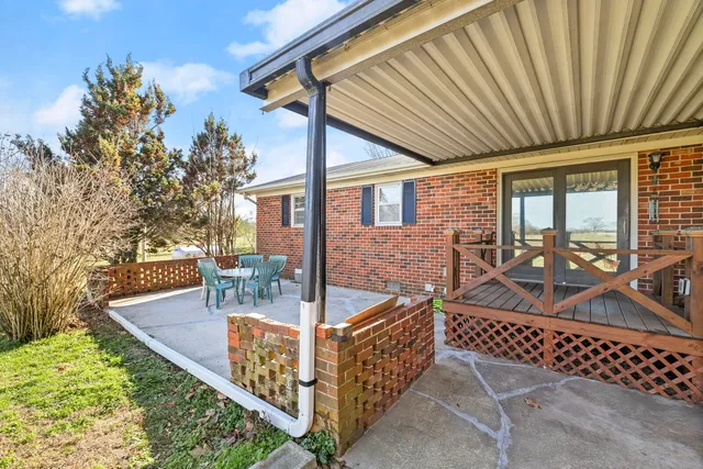 a kitchen with stainless steel appliances granite countertop a refrigerator and a stove