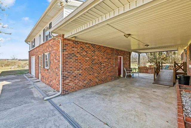 a view of room with furniture and a window
