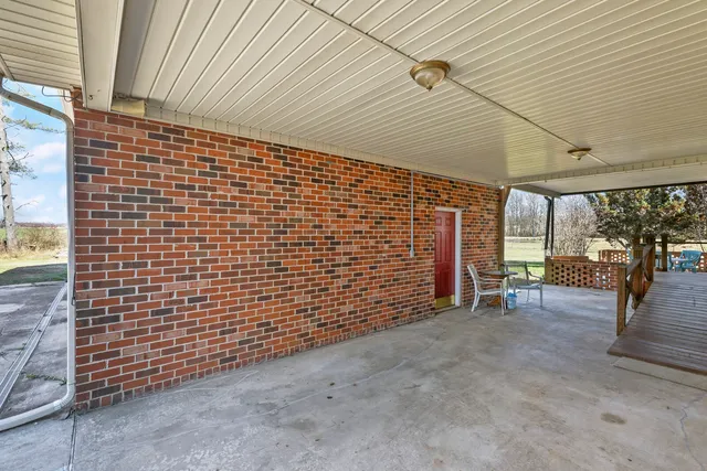 a living room with lots of furniture and a chandelier