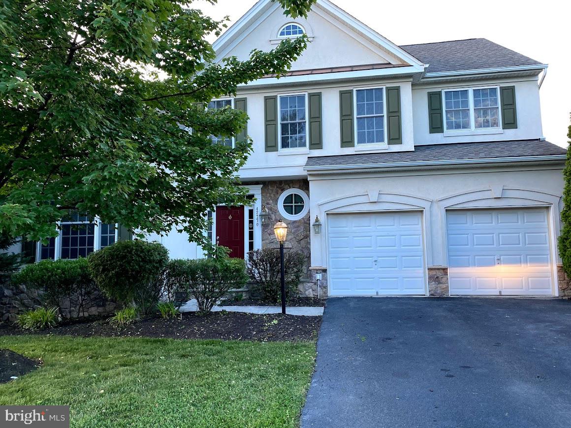 42770 Conquest Circle Brambleton, VA 20148 - Photo 1 of 70 front view of a house with a yard