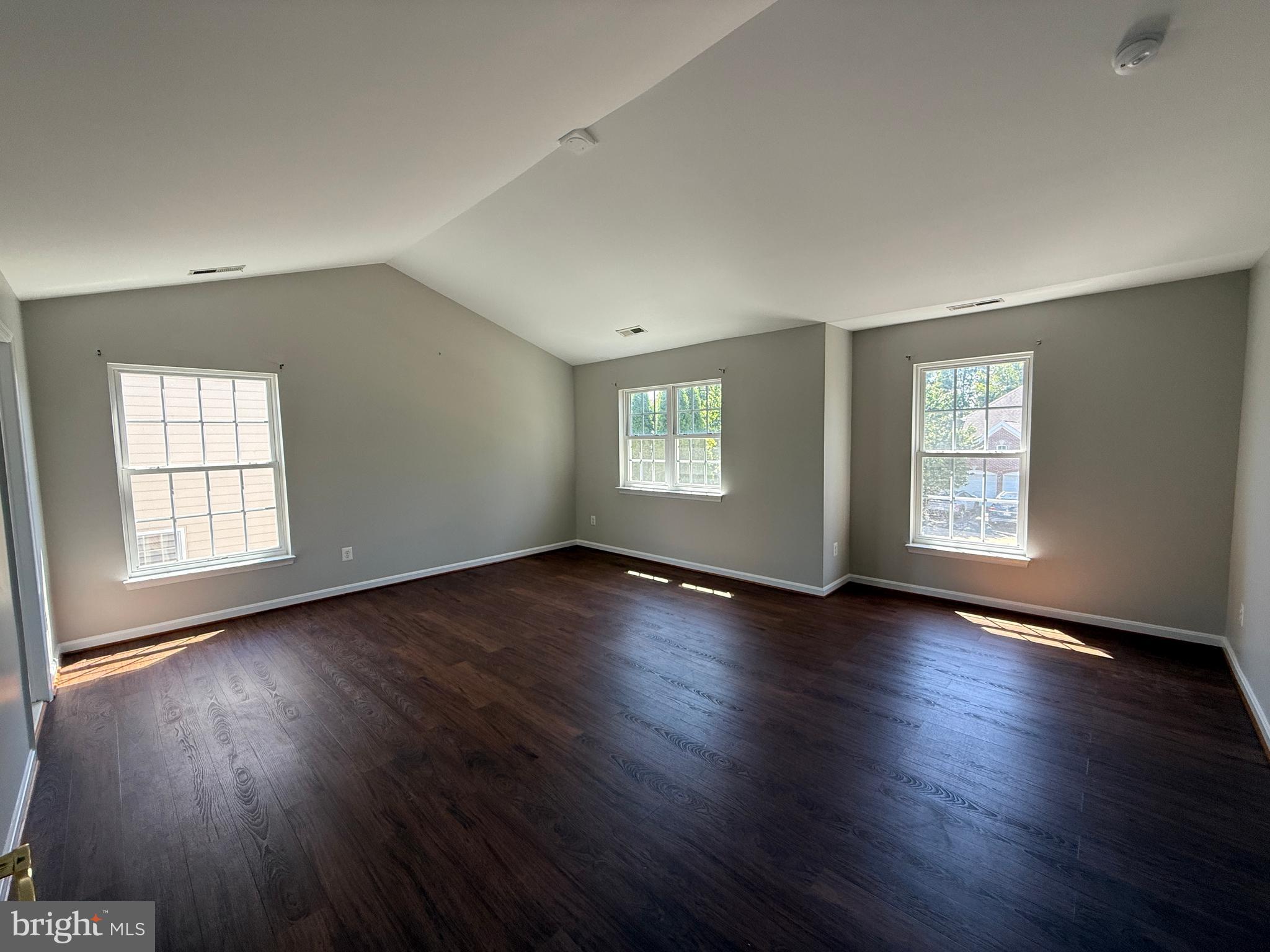 42770 Conquest Circle Brambleton, VA 20148 - Photo 32 of 70 a view of an empty room with wooden floor and window