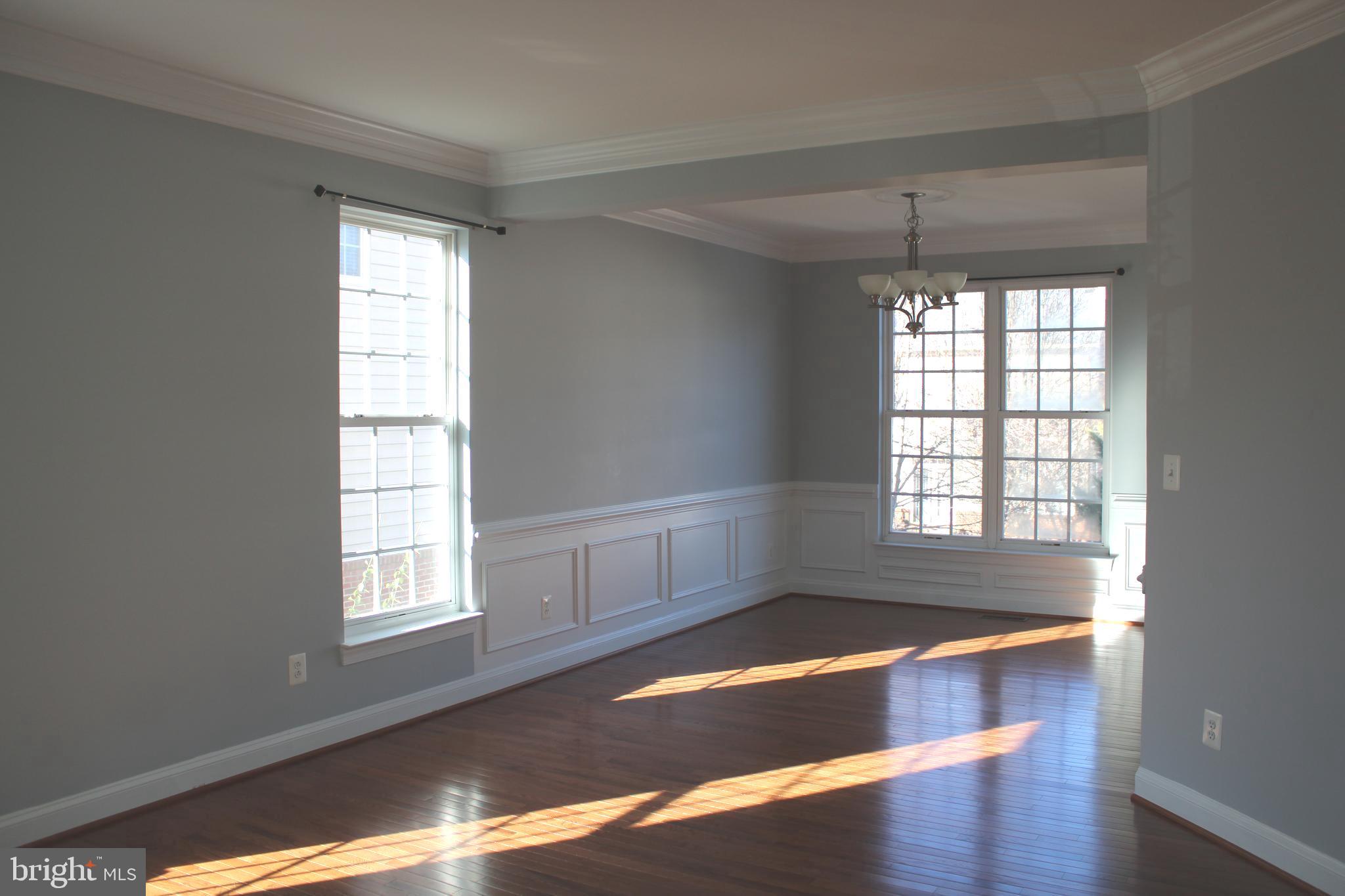 42770 Conquest Circle Brambleton, VA 20148 - Photo 4 of 70 a view of room with window and wooden floor