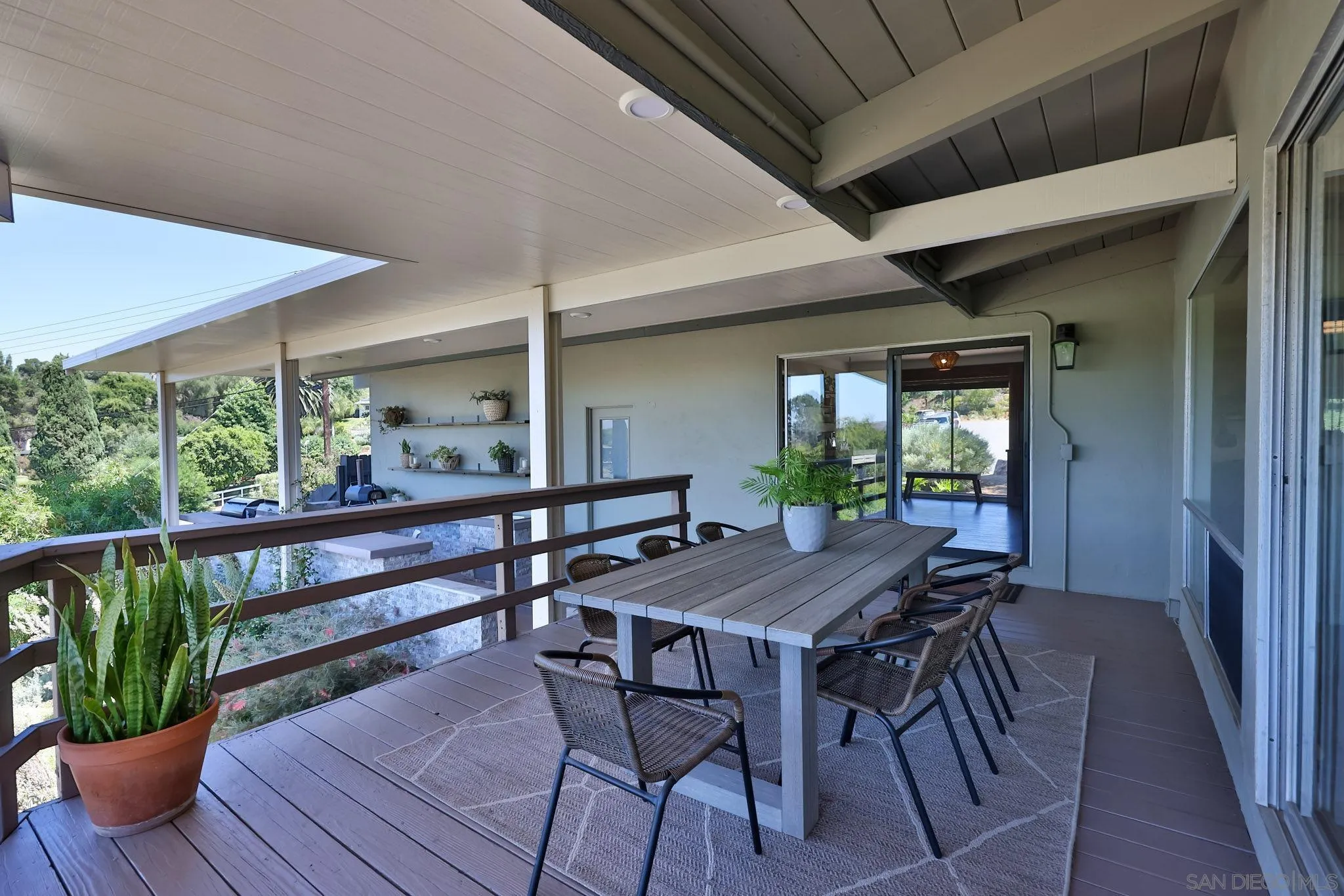 10993 Explorer Road La Mesa, CA 91941 - Photo 17 of 34 a table and chairs in front of a house