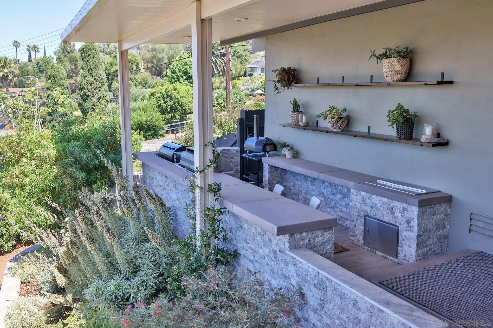 10993 Explorer Road La Mesa, CA 91941 - Photo 18 of 34 a living room with furniture and a floor to ceiling window