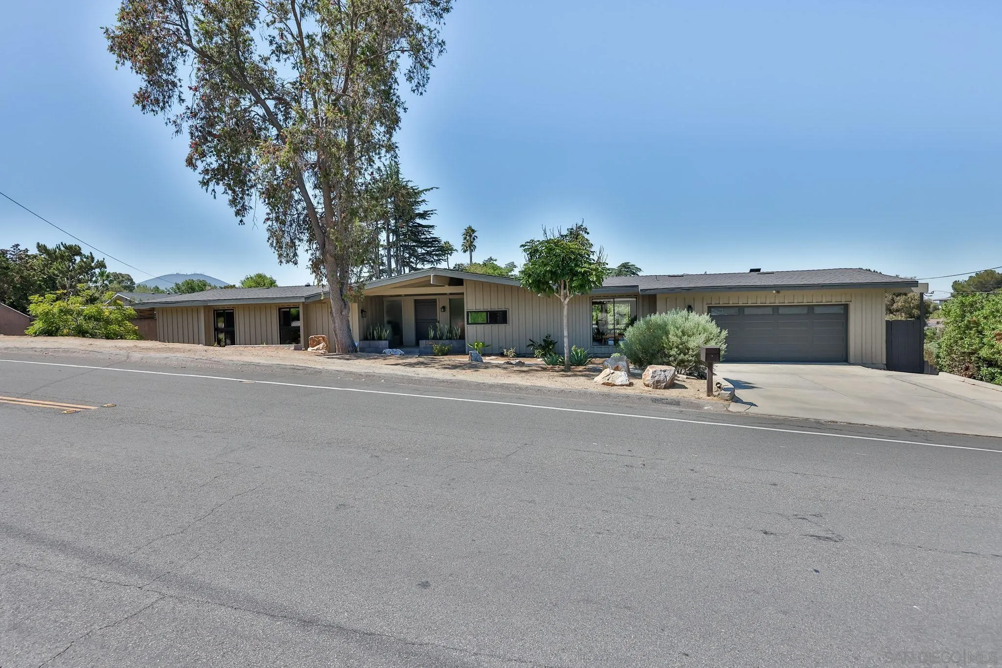 10993 Explorer Road La Mesa, CA 91941 - Photo 2 of 34 front view of a house with a street