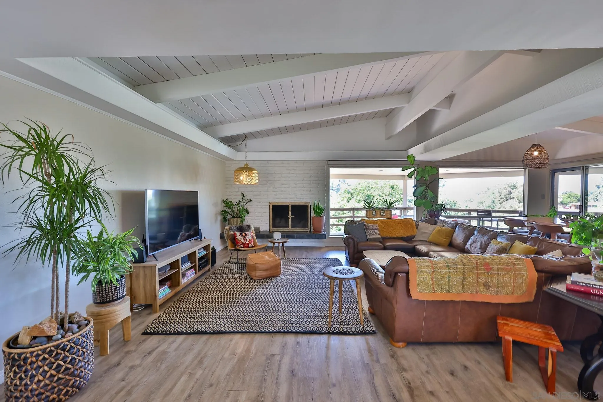 10993 Explorer Road La Mesa, CA 91941 - Photo 3 of 34 a living room with furniture flat screen tv and a fireplace