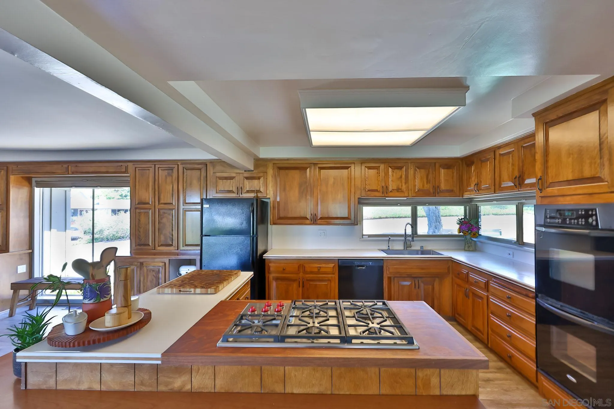 10993 Explorer Road La Mesa, CA 91941 - Photo 6 of 34 a kitchen with stainless steel appliances granite countertop a sink stove and cabinets