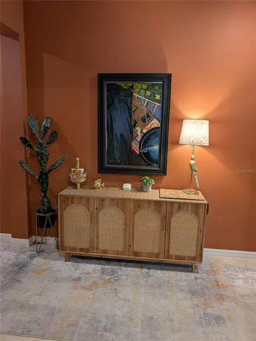 a view of a livingroom with furniture and a window