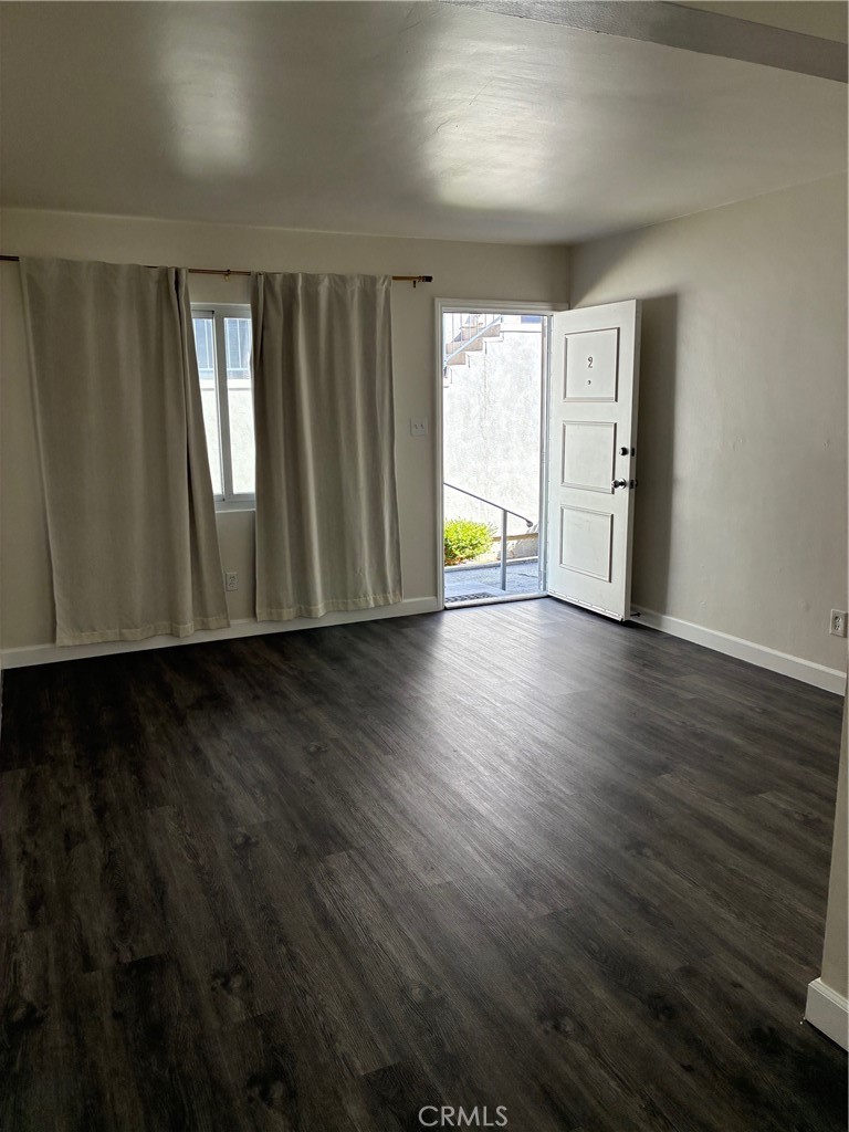 640 West Imperial Avenue, Unit 2 El Segundo, CA 90245 - Photo 4 of 9 a view of a livingroom with wooden floor and window