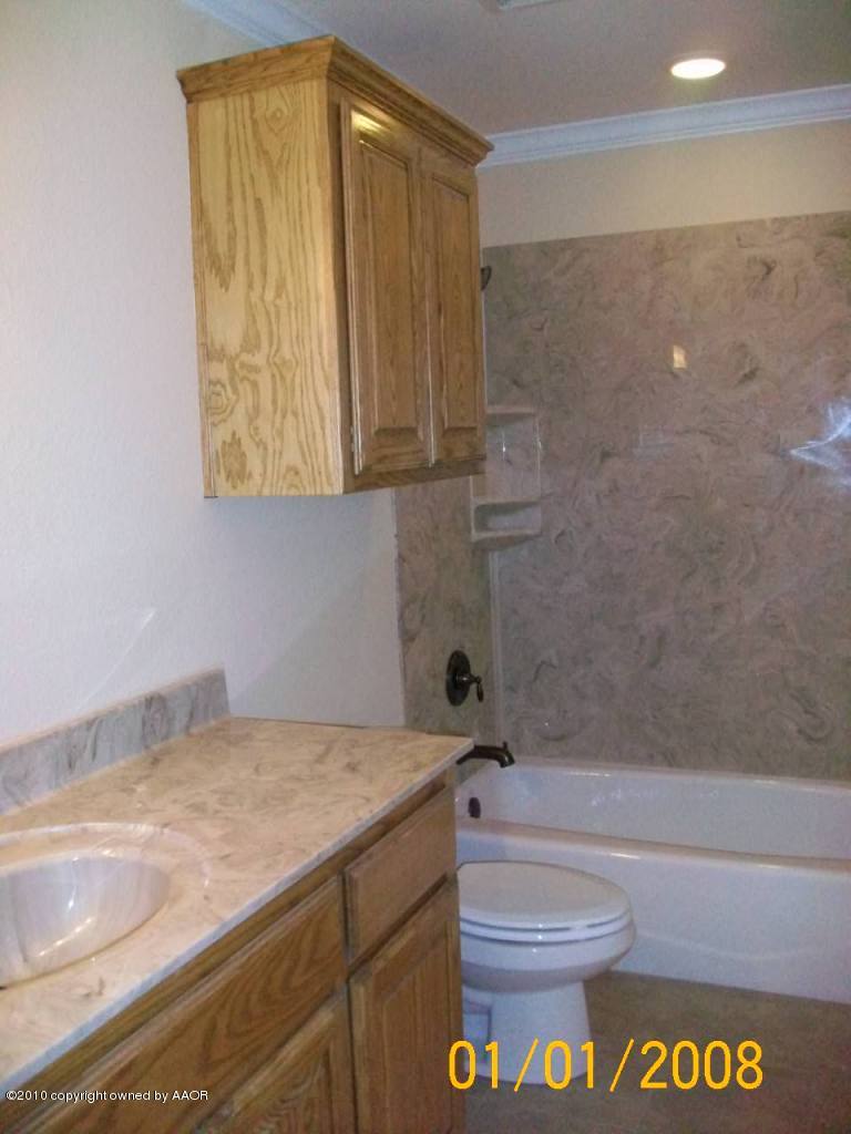 18350 Copper Ridge Bushland, TX 79124 - Photo 18 of 24 a bathroom with a sink and a toilet