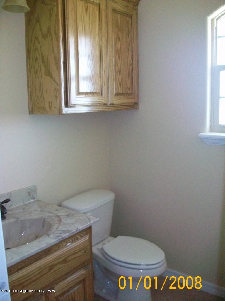 18350 Copper Ridge Bushland, TX 79124 - Photo 19 of 24 a bathroom with a toilet and a window