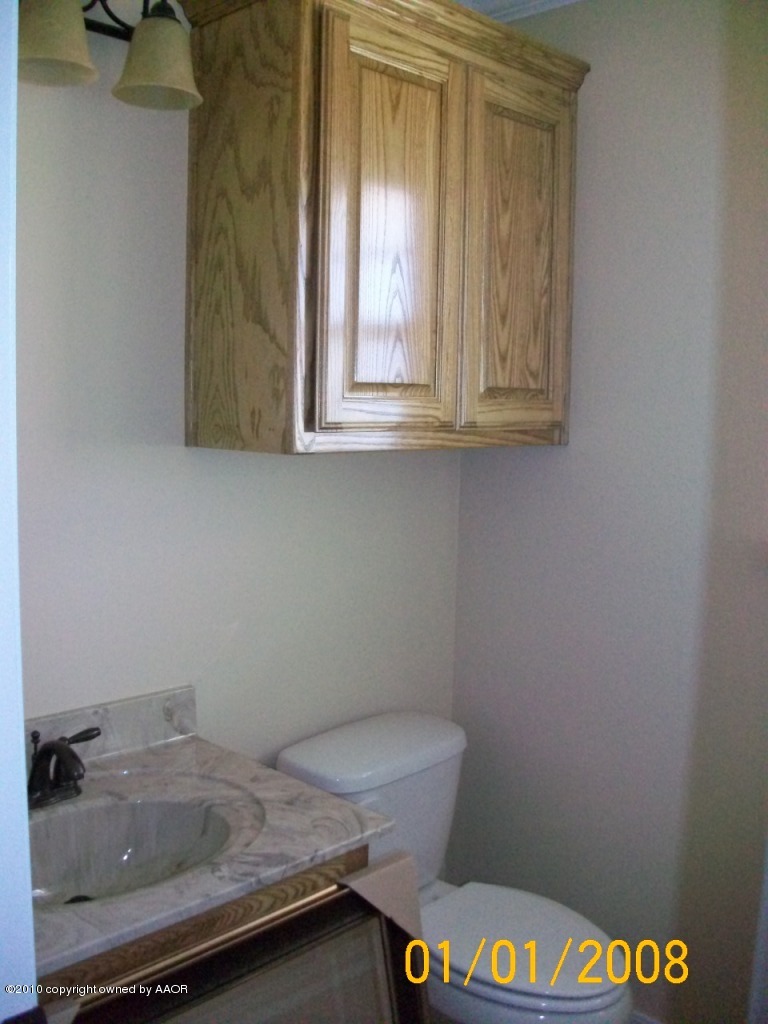 18350 Copper Ridge Bushland, TX 79124 - Photo 21 of 24 a bathroom with a sink and a toilet