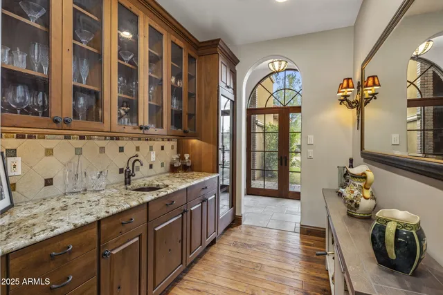 a spacious bathroom with a tub a double vanity sink a mirror and shower