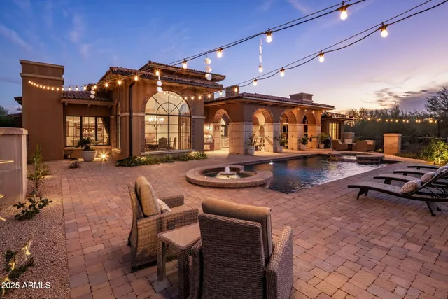 a swimming pool with outdoor seating and yard