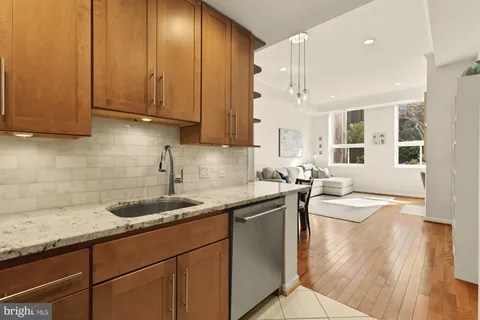 a kitchen that has a sink and cabinets