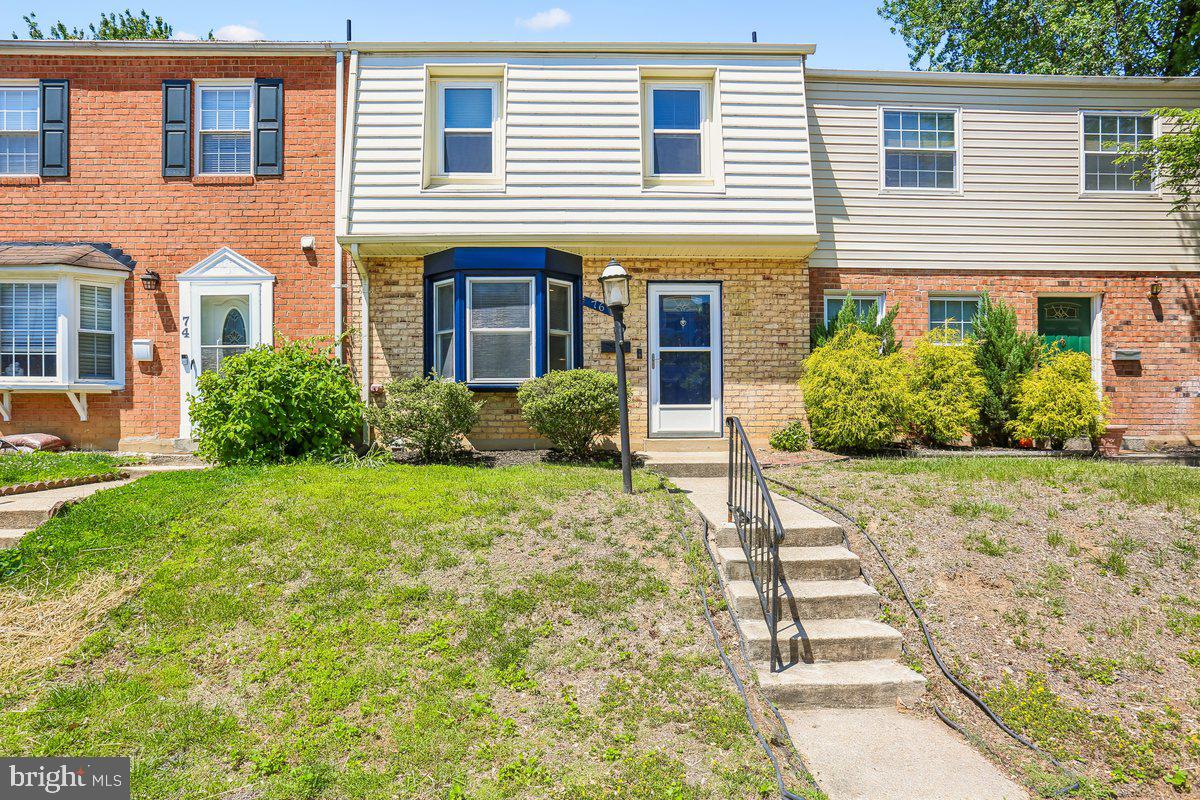76 Timber Rock Road Gaithersburg, MD 20878 - Photo 1 of 51 a front view of a house with garden