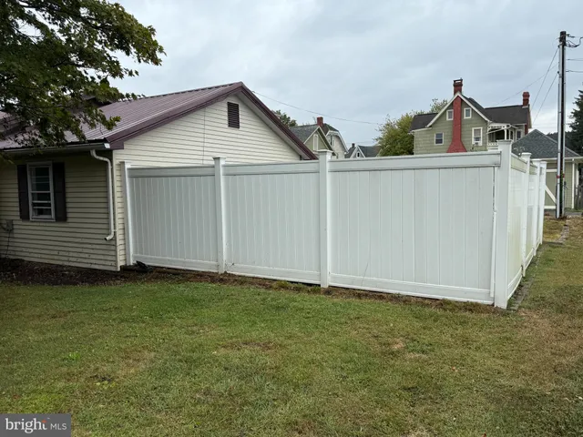 a view of a backyard of the house