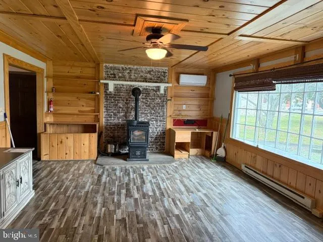 a room with wooden floor and furniture