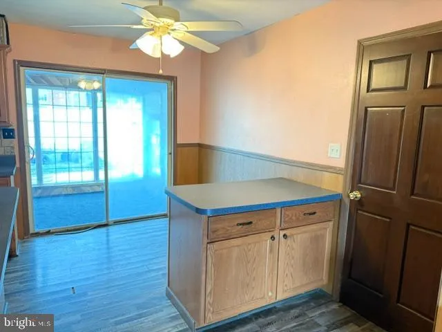 a kitchen with a refrigerator and a sink