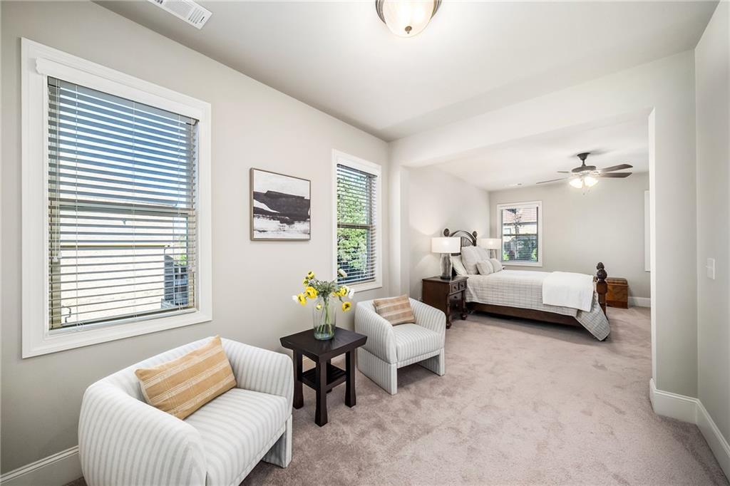 6660 Tulip Plantation Road Alpharetta, GA 30004 - Photo 22 of 68 a bedroom with furniture and a window
